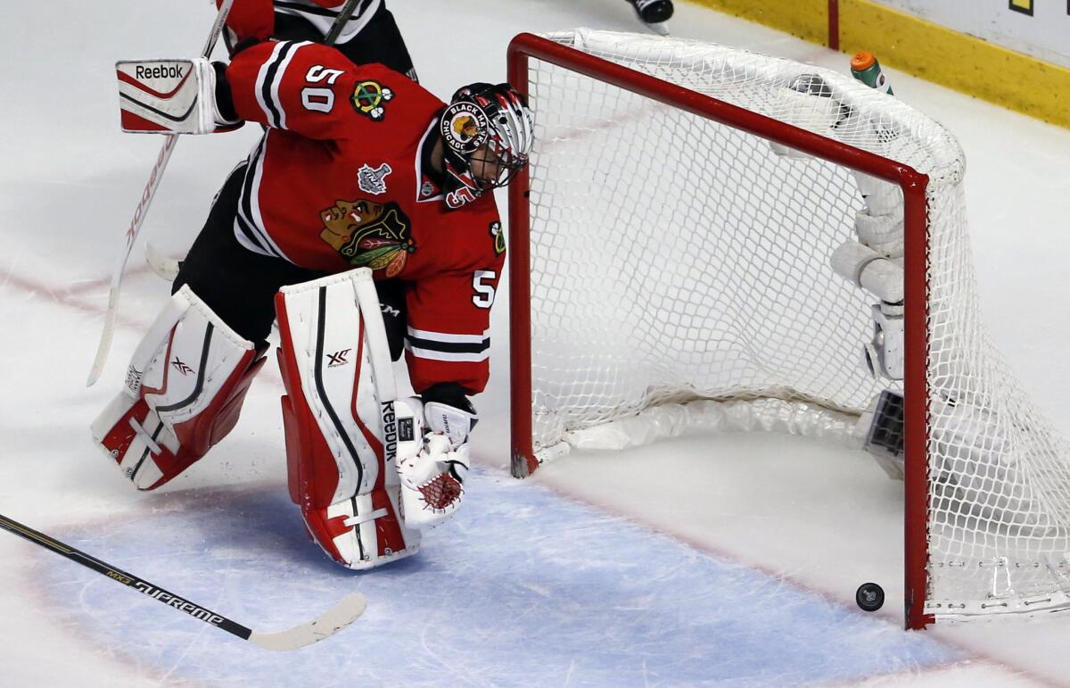 Chicago goalie Corey Crawford watches as a shot from Tampa Bay's Cedric Paquette finds the back of the net during the third period of the Lightning's 3-2 victory over the Blackhawks.