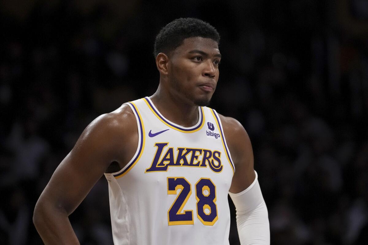 Lakers forward Rui Hachimura catches his breath during a break in play.