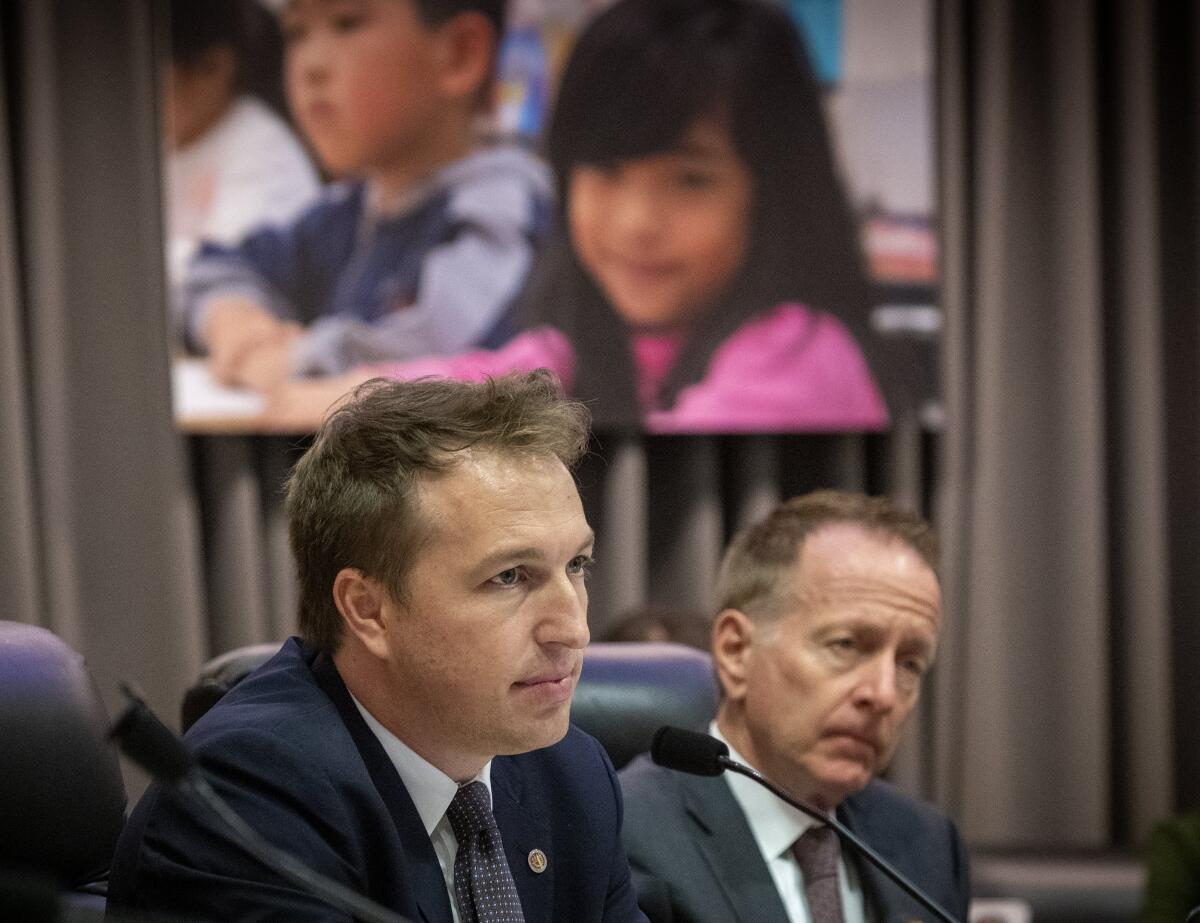 L.A. Unified school board member Nick Melvoin, left, and his colleagues will soon consider whether to allow noncitizens to vote in the board elections.