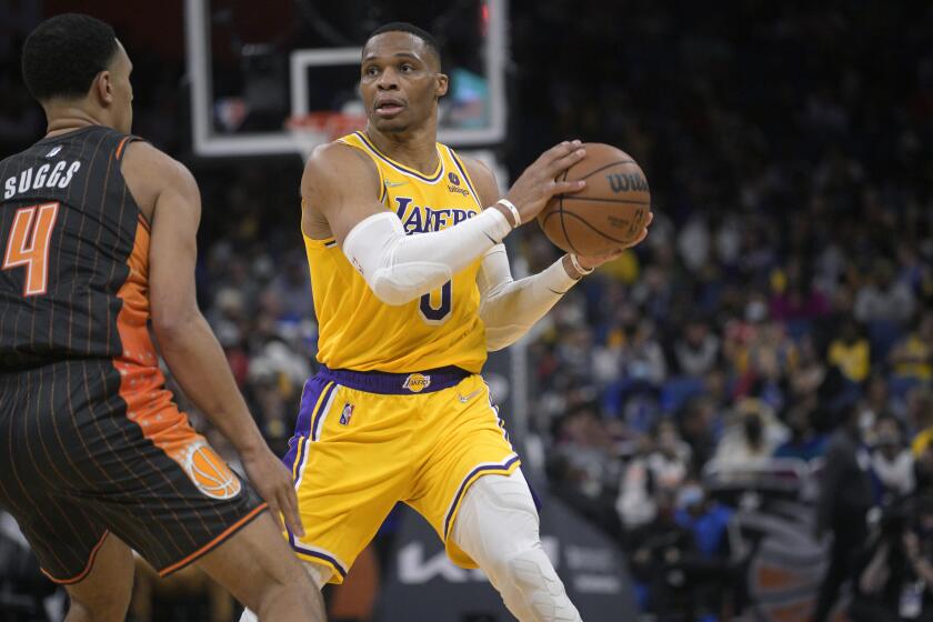 Lakers guard Russell Westbrook (0) looks to pass the ball