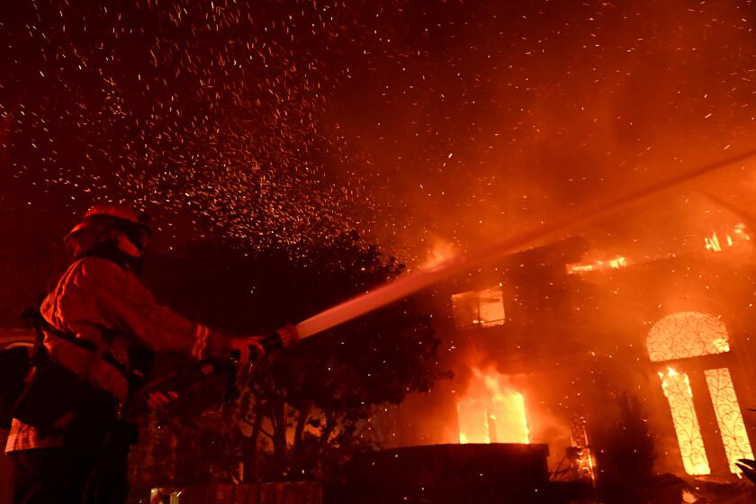 Laguna Niguel, California May 11, 2022- Firefighters battle the Coastal fire at Coronado Pointe in Laguna Niguel Wednesday. (Wally Skalij/Los Angeles Times)