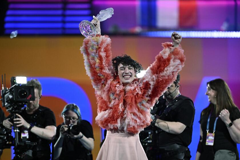 Nemo, representing Switzerland, with the song "The Code," wins the final of the 68th edition of the Eurovision Song Contest at the Malmö Arena, in Malmö, Sweden, Saturday, May 11, 2024. (Jessica Gow/TT News Agency via AP)