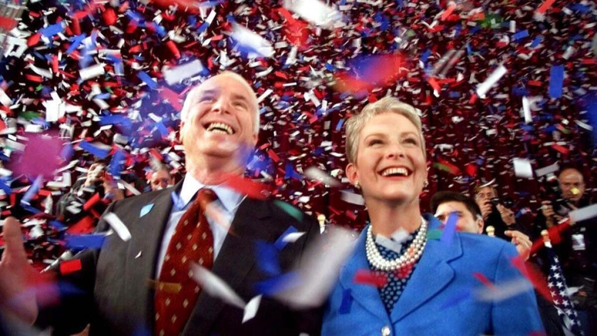 Confetti falls on Republican presidential hopeful Sen. John McCain (R-Ariz.) and his wife, Cindy, at the end of their 114th New Hampshire town hall meeting with voters in Peterborough, N.H., in January 2000.