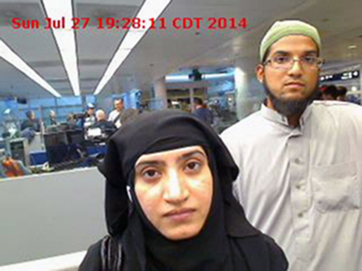 Tashfeen Malik, left, and Syed Farook at O'Hare International Airport in Chicago on July 27, 2014.