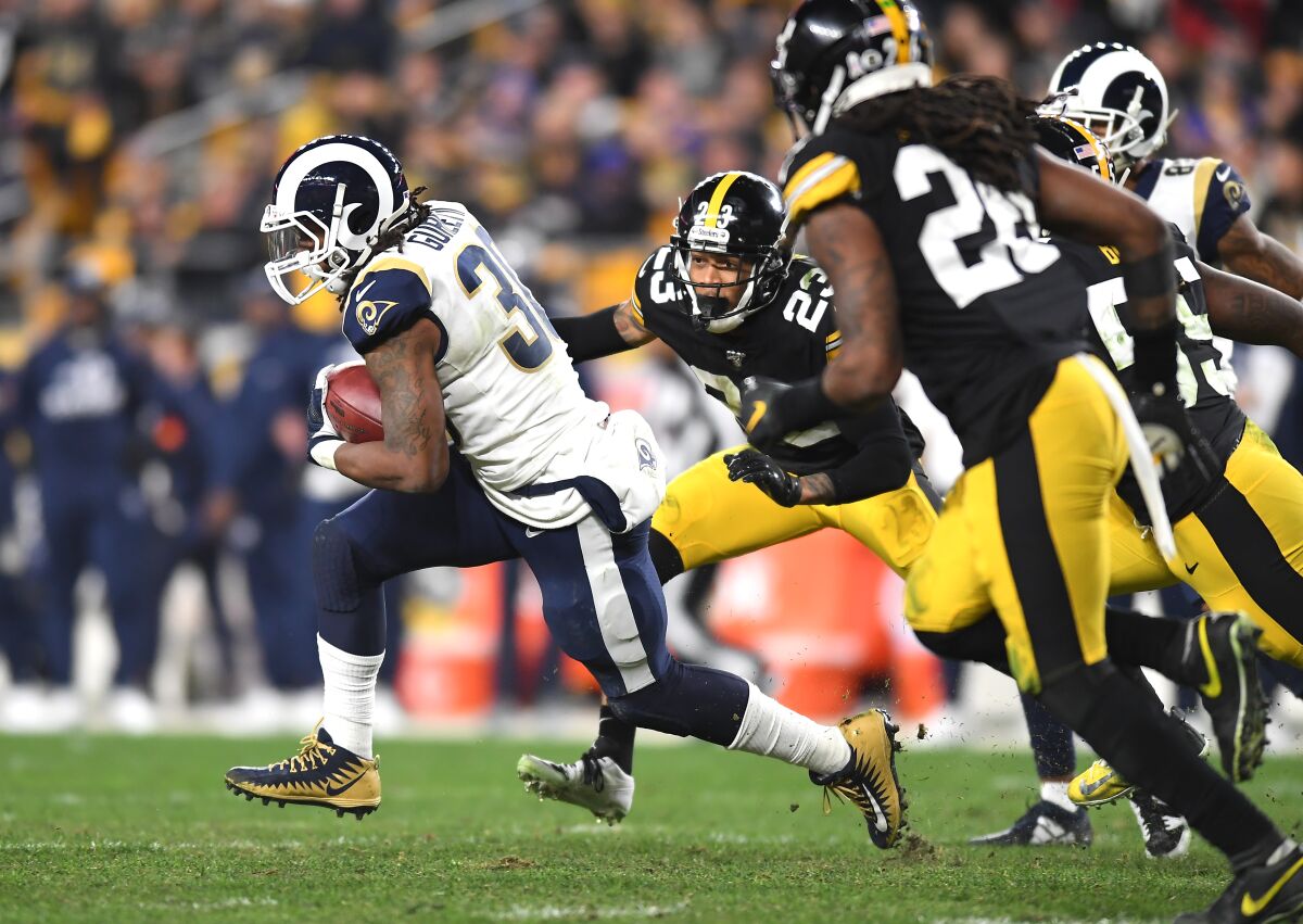 Rams running back Todd Gurley breaks free from the Steelers' defense for a gain in the third quarter.