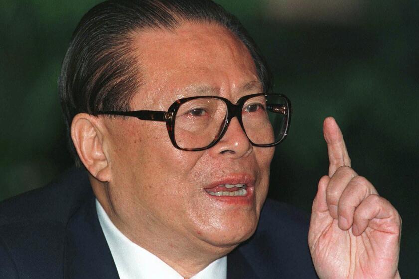 FILE - Chinese then President Jiang Zemin makes a point during a press conference in Beijing, one day before his departure for an eight-day visit to the U.S, Oct. 25, 1997. Jiang has died in Shanghai Wednesday, Nov. 30, 2022, at age 96, according to state media. (AP Photo/Greg Baker, File)