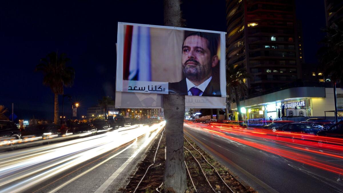 A poster in Beirut shows Prime Minister Saad Hariri with Arabic words reading "We are all Saad."
