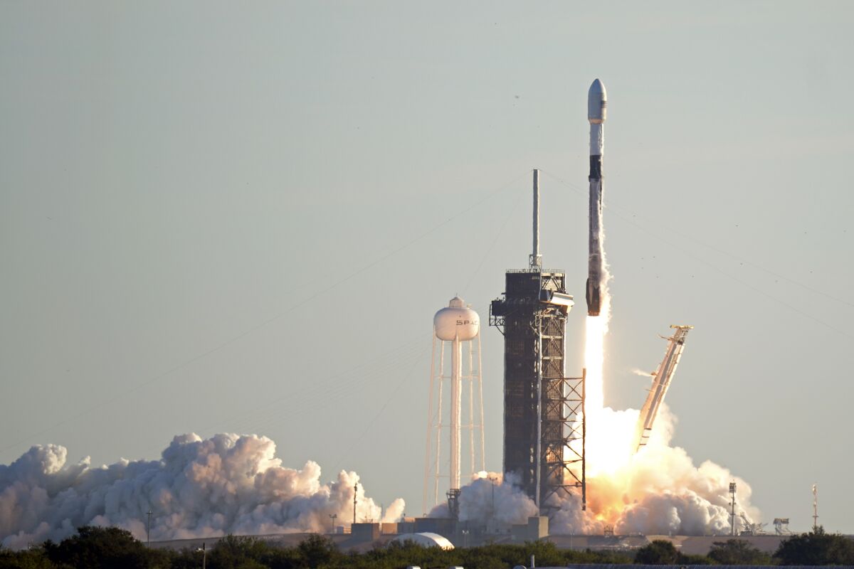 A Falcon 9 SpaceX rocket lifts off from pad 39A at the Kennedy Space Center in Cape Canaveral, Fla.,  Jan. 20, 2021.  
