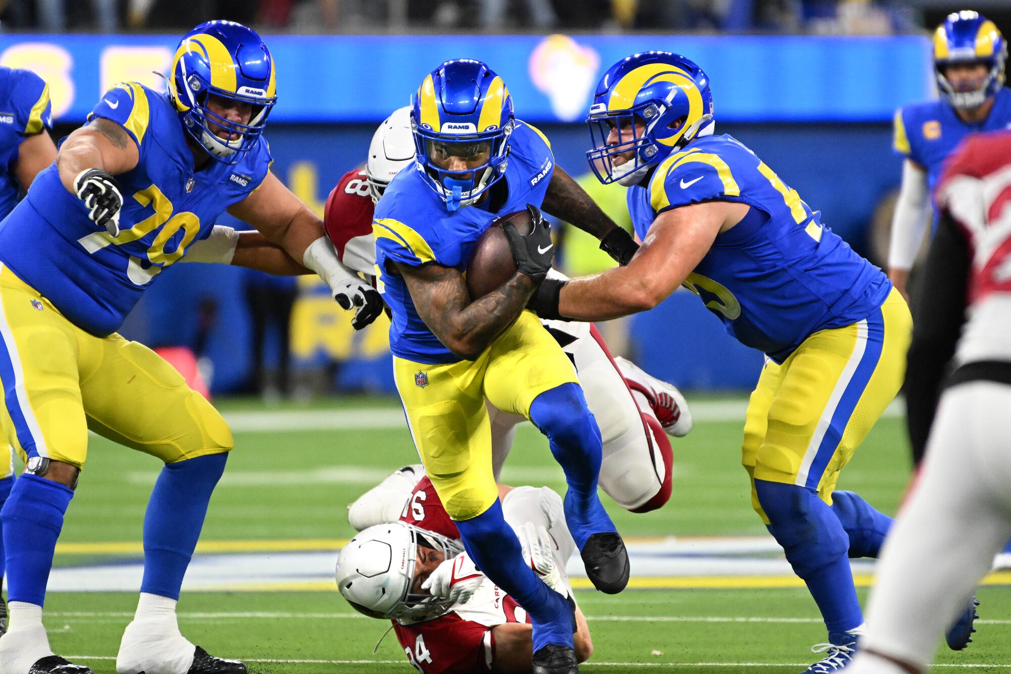 Rams running back Cam Akers breaks a tackle against the Cardinals in the first quarter.