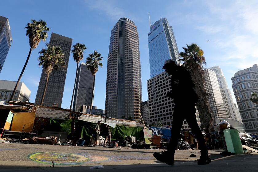 LOS ANGELES, CALIF. - NOV. 15, 2021. A homeless encampment in downtown Los Angeles on Monday, Nov. 15, 2021. (Luis Sinco / Los Angeles Times)