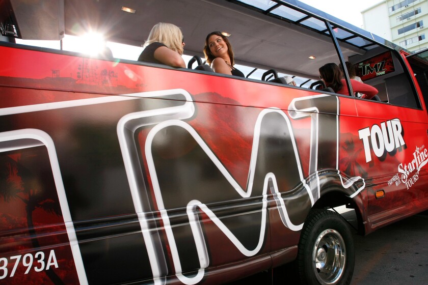 Tourists head out on a TMZ Hollywood tour in 2012. TMZ and Starline Tours are fighting in court over proceeds from that joint operation.