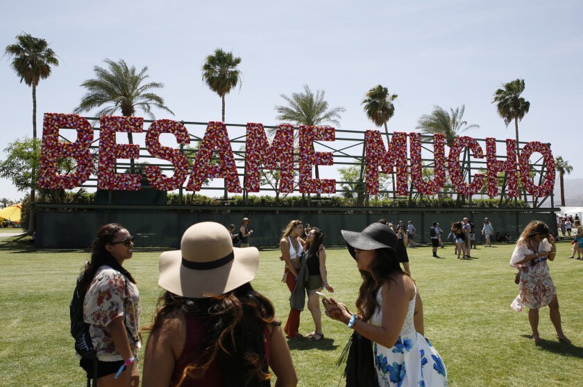 At the Coachella Valley Music & Arts Festival, an art installation titled "Besame Mucho" (which translates from Spanish into "Kiss me many times") extends a welcome to the United States' Latin neighbors, rather than locking them out as some GOP candidates have proposed.