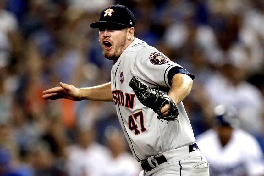 Mandatory Credit: Photo by MIKE NELSON/EPA-EFE/REX/Shutterstock (9174521dg) Chris Devenski Houston Astros at Los Angeles Dodgers, USA - 25 Oct 2017 Houston Astros relief pitcher Chris Devenski celebrates after defeating the Los Angeles Dodgers in game two of the Major League Baseball (MLB) World Series at Dodger Stadium in Los Angeles, California, USA, 25 October 2017. The best-of-seven series is tied 1-1. ** Usable by LA, CT and MoD ONLY **