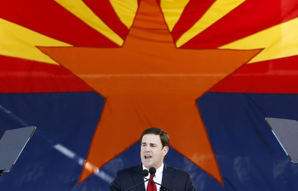 Republican Arizona Gov. Doug Ducey addresses the crowd after being sworn in Jan. 5. Ducey has signed a bill creating a new high school civics test.