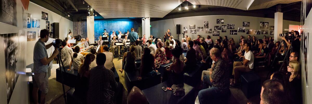 A panorama of Blue Whale owner Joon Lee, singing at the club in 2014. 