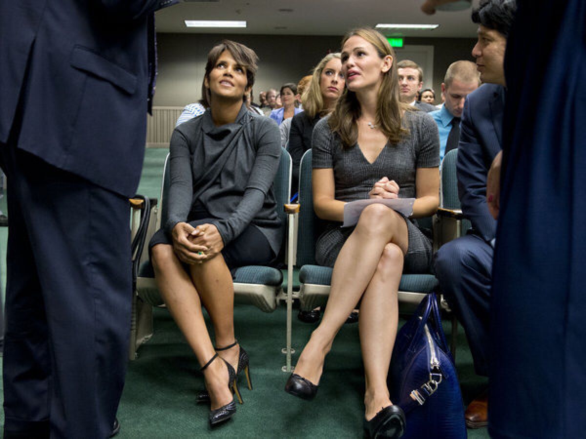 Actresses Halle Berry, left, and Jennifer Garner sit before they testify at the state Capitol Aug. 13 in favor of a bill aimed at restricting paparazzi access to children.