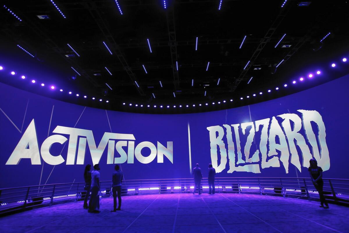 A unit of Activision Blizzard, whose booth is shown at L.A.'s Electronic Entertainment Expo, is banning a player from competition and withholding winnings.
