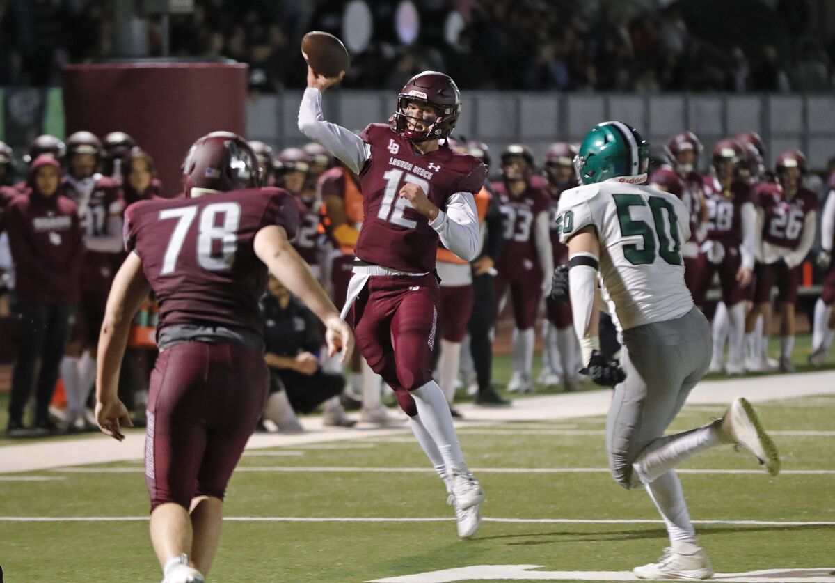 A scrambling Jackson Kollock (12) finds a receiver for a touchdown against Granada Hills on Dec. 3, 2022.