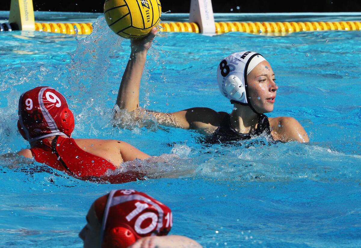 Newport Harbor's Madison Mack (8) looks for an open player during the semifinals.