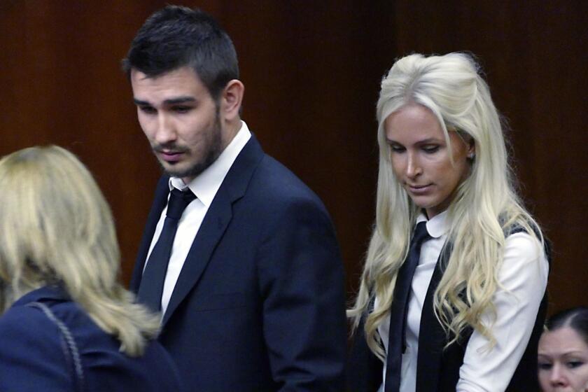 Los Angeles Kings' Slava Voynov enters Superior Court with his wife, Marta Varlamova, Thursday July 2, 2015 in Torrance, Calif. Los Angeles Kings defenseman Slava Voynov pleaded no contest to a misdemeanor Thursday in a domestic violence incident with his wife that escalated after a Halloween party last year.(Brad Graverson/The Daily Breeze via AP) MAGS OUT; NO SALES; MANDATORY CREDIT