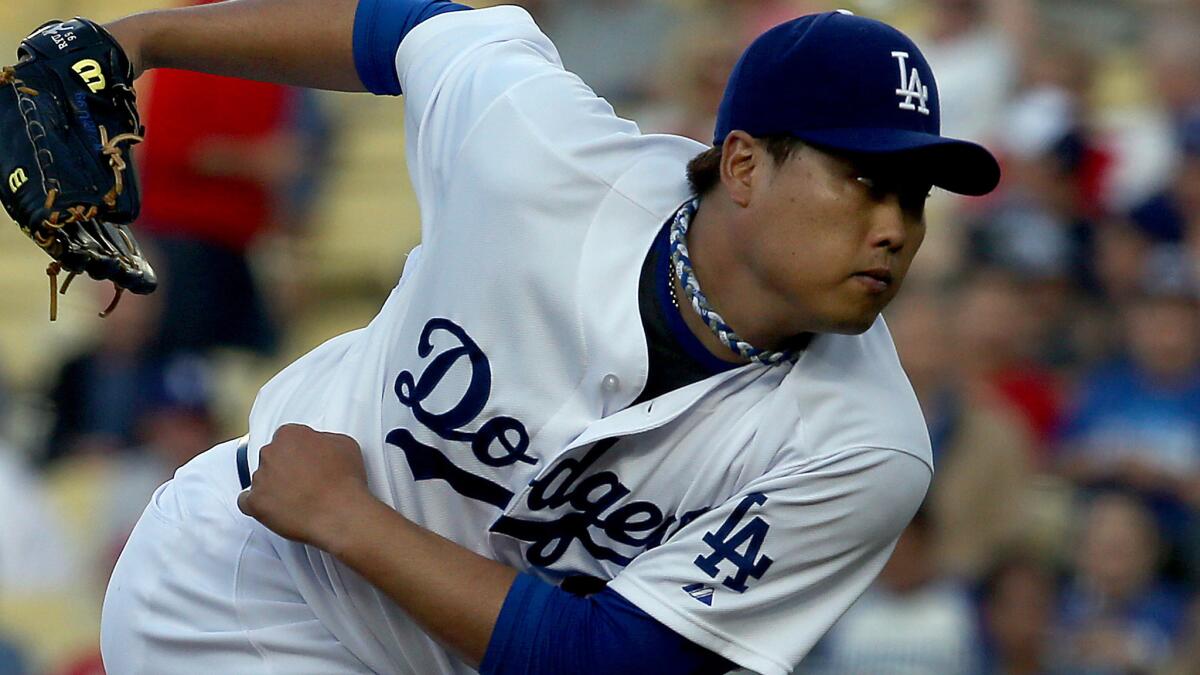 Dodgers starter Hyun-Jin Ryu delivers a pitch against the St. Louis Cardinals in June. Ryu threw a pain-free bullpen session Sunday.