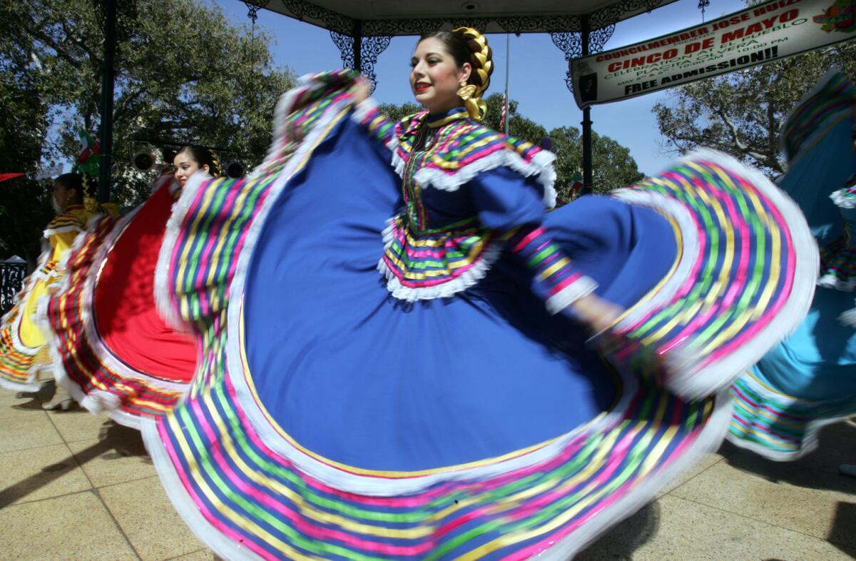 Dancers from the Paso de Oro Dance Company of Santa Fe Springs perform during the Cinco de Mayo celebration at the El Pueblo de Los Angeles Historical Monument.