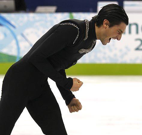 Evan Lysacek shows elation -- with good reason -- after completing his free-skate program Thursday in the men's figure skating final. Lysacek of the U.S. was awarded the gold medal, with Russia's Evgeni Plushenko the runner-up.