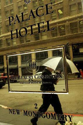 A pedestrian's reflection is caught in a brass plaque in front of the Palace Hotel in San Francisco. Famed opera singer Enrico Caruso was staying at the hotel when the 1906 quake hit.