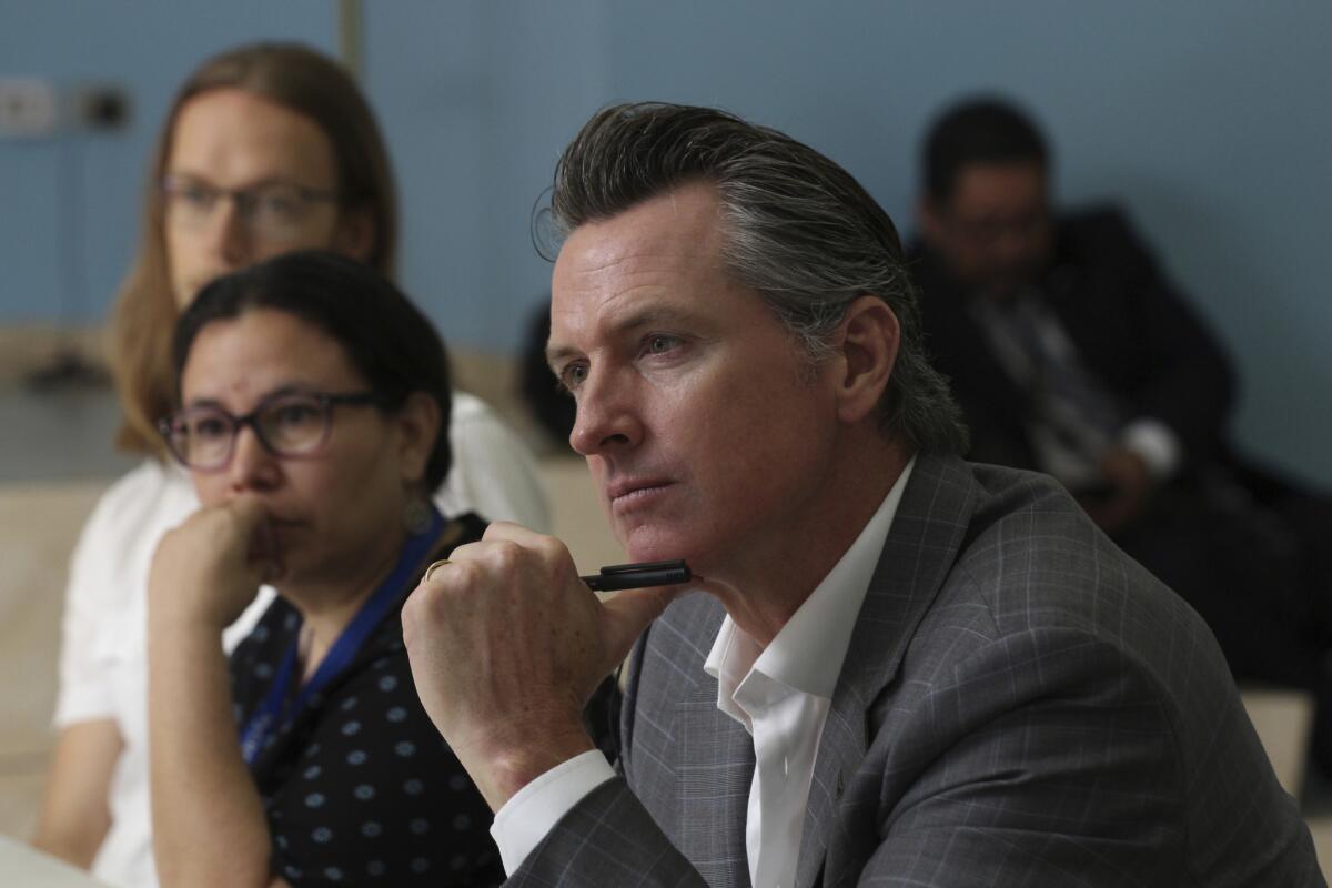 California Gov. Gavin Newsom during a meeting at the Divina Providencia Hospital facility in San Salvador on April 9.