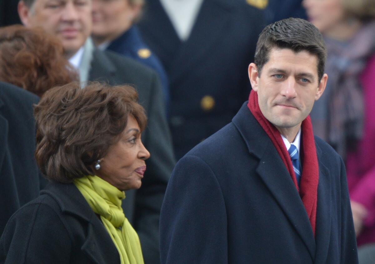 Rep. Paul Ryan (R-Wis.) attends President Obama's inauguration with Rep. Maxine Waters (D-Calif.).