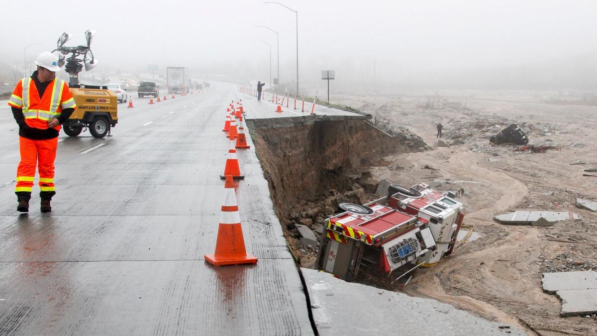 A San Bernardino County fire truck plunged off the southbound 15 Freeway just south of Highway 138 when the right lane and shoulder caved in after heavy rains in the Cajon Pass.