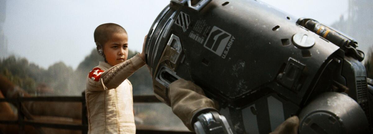 A child android touches a robot.