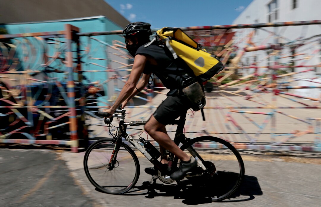 Coronavirus has turned once-bustling downtown L.A. into a
ghost town. Can it recover? 3 Jimmy Lizama is a bicycle messenger in Los Angeles.