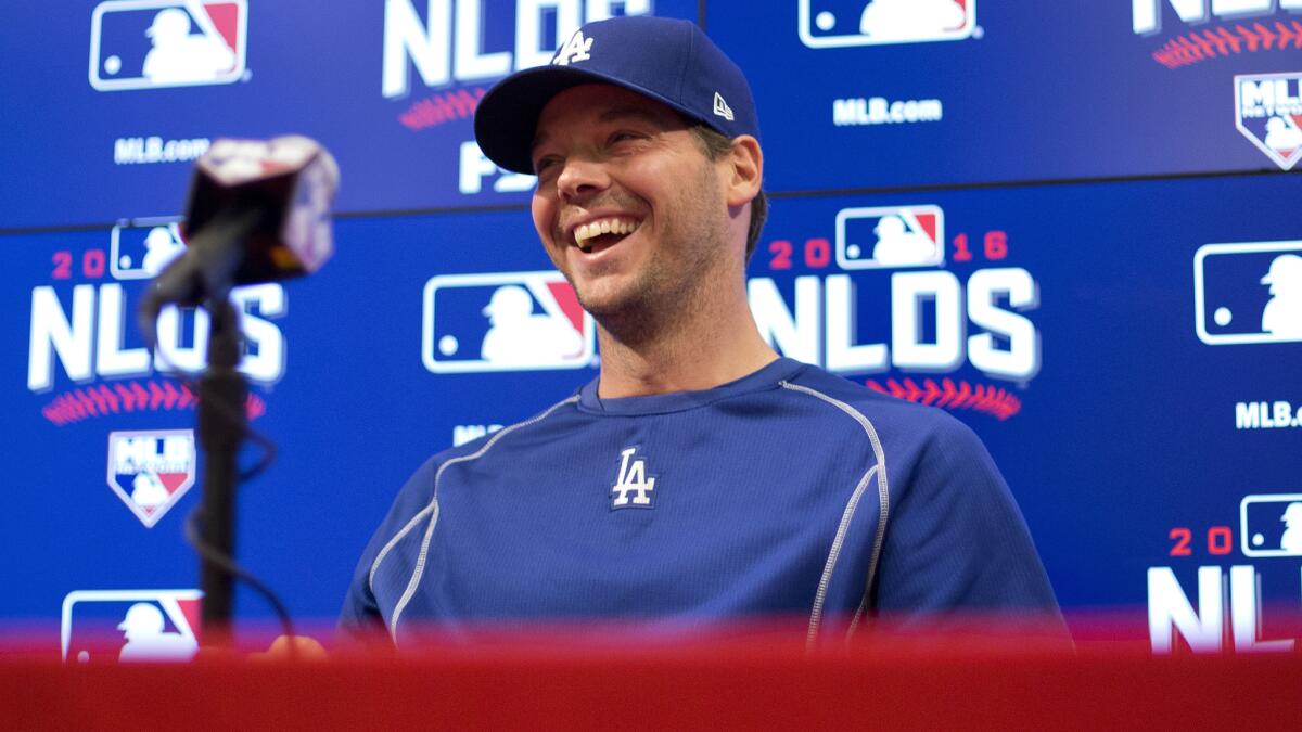 Dodgers pitcher Rich Hill breaks into a laugh when answering a reporter's question before Game 1 on Friday in Washington.