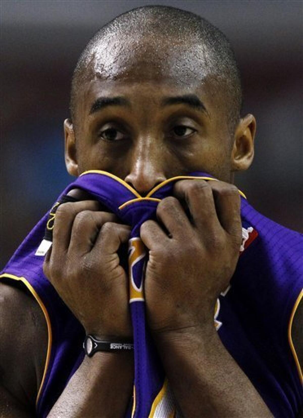 FILE - In this Dec. 17, 2010 file photo, Los Angeles Lakers' Kobe Bryant wears a Power Balance bracelet on his right wrist during an NBA basketball game against the Philadelphia 76ers in Philadelphia. Australian authorities on Tuesday, Jan. 4, 2010 said the California-based company behind the wildly popular Power Balance wristbands and pendants has no business claiming that they can improve balance, strength and flexibility. And they even got Power Balance to admit it. (AP Photo/Matt Slocum)