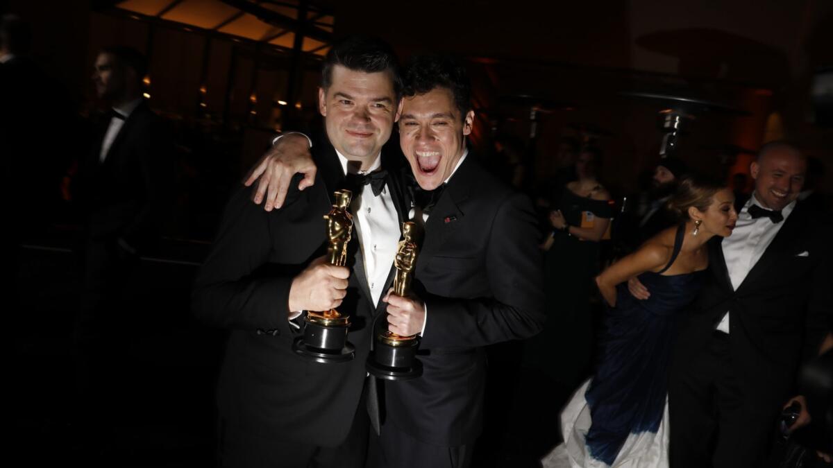 "Spiderman: Into the Spider-Verse's" Christopher Miller, left, and Phil Lord. The film won for animated feature.