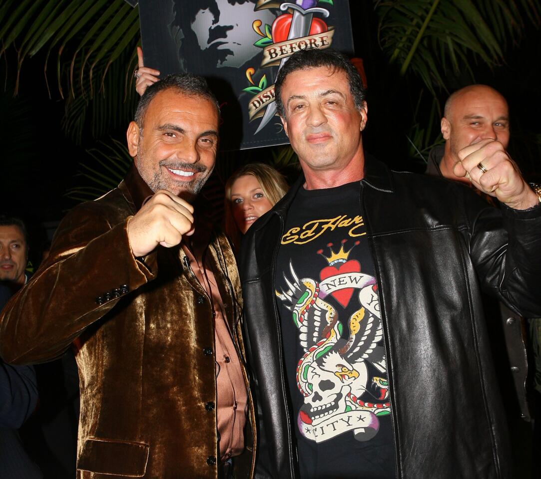 Christian Audigier, left, and Sylvester Stallone attend the Ed Hardy Swimwear launch fashion show at Audigier's house Dec. 13, 2007, in Los Angeles.