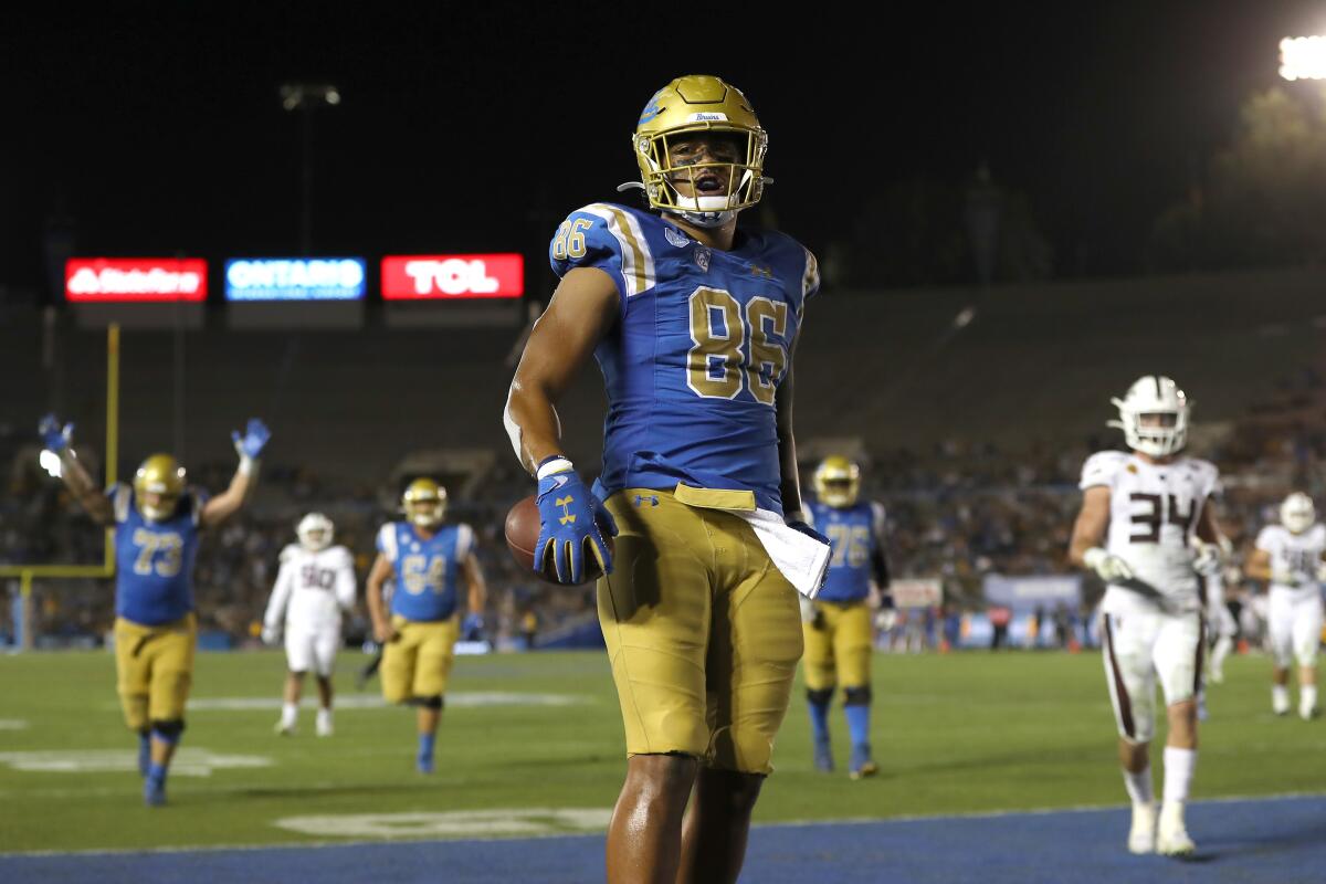 UCLA tight end Devin Asiasi reacts after scoring a touchdown against Arizona State on Oct. 26, 2019.