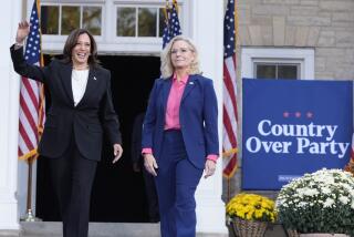 Democratic presidential nominee Vice President Kamala Harris, left, arrives to speak at a campaign event with former Congresswoman Liz Cheney, R-Wyo., right, at Ripon College in Ripon, Wis., Thursday, Oct. 3, 2024. (AP Photo/Mark Schiefelbein)