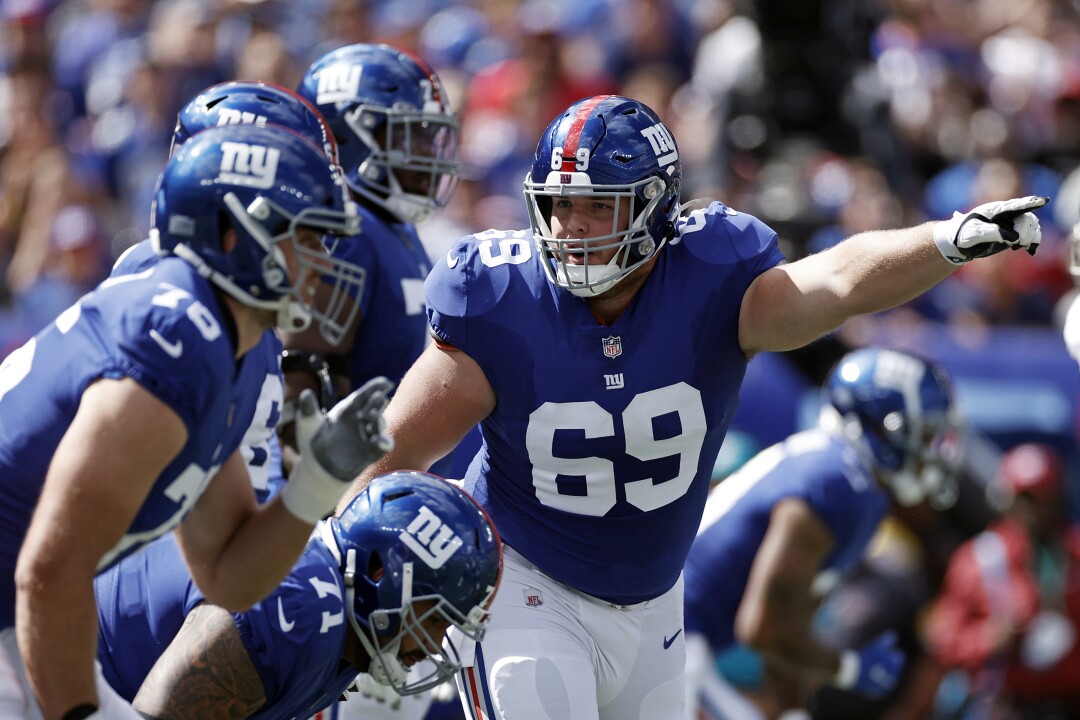 New York Giants center Billy Price gestures against the Atlanta Falcons.