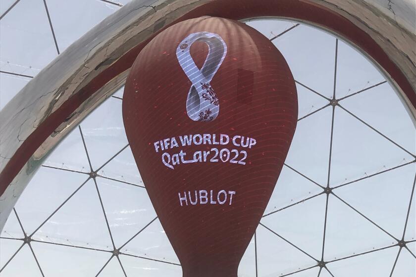 A clock in Doha, Qatar, counts down the days until it hosts the next FIFA World Cup.