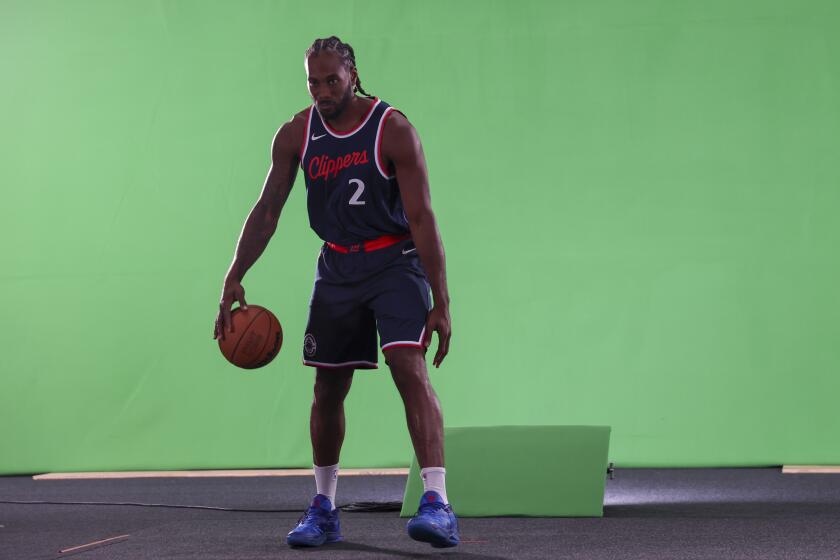 LA Clippers forward Kawhi Leonard poses during the NBA basketball team's media day, Monday, Sept. 30, 2024, in Inglewood. (AP Photo/Ryan Sun)