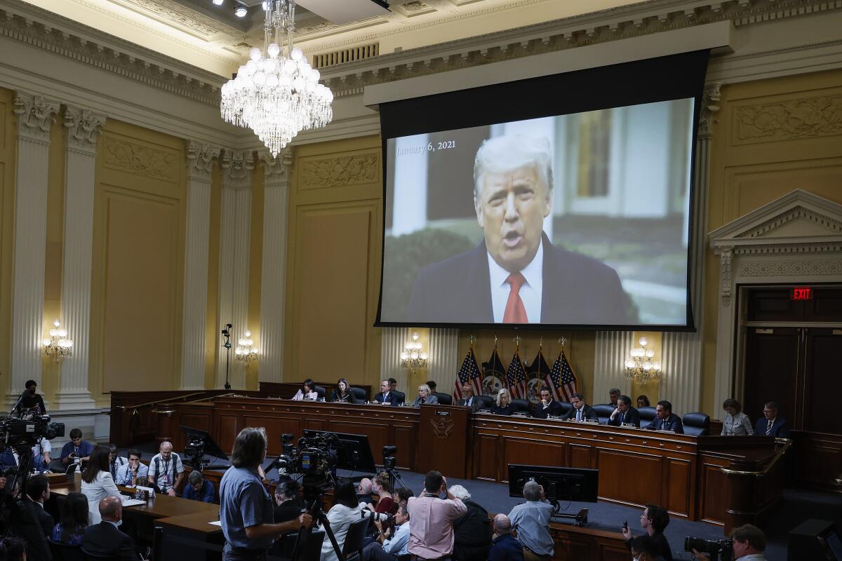 A screen at a Jan. 6 committee hearing shows former President Trump 