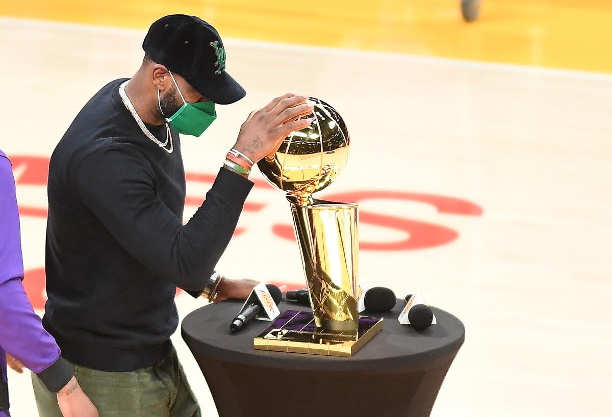 Lakers unveil NBA title banner, then barely beat lowly Rockets