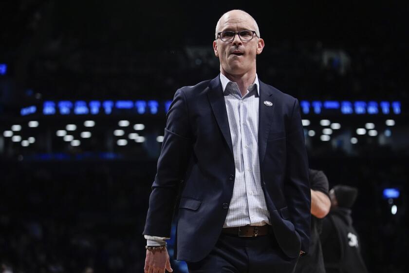 UConn head coach Dan Hurley walks into the locker room at halftime of a second-round.