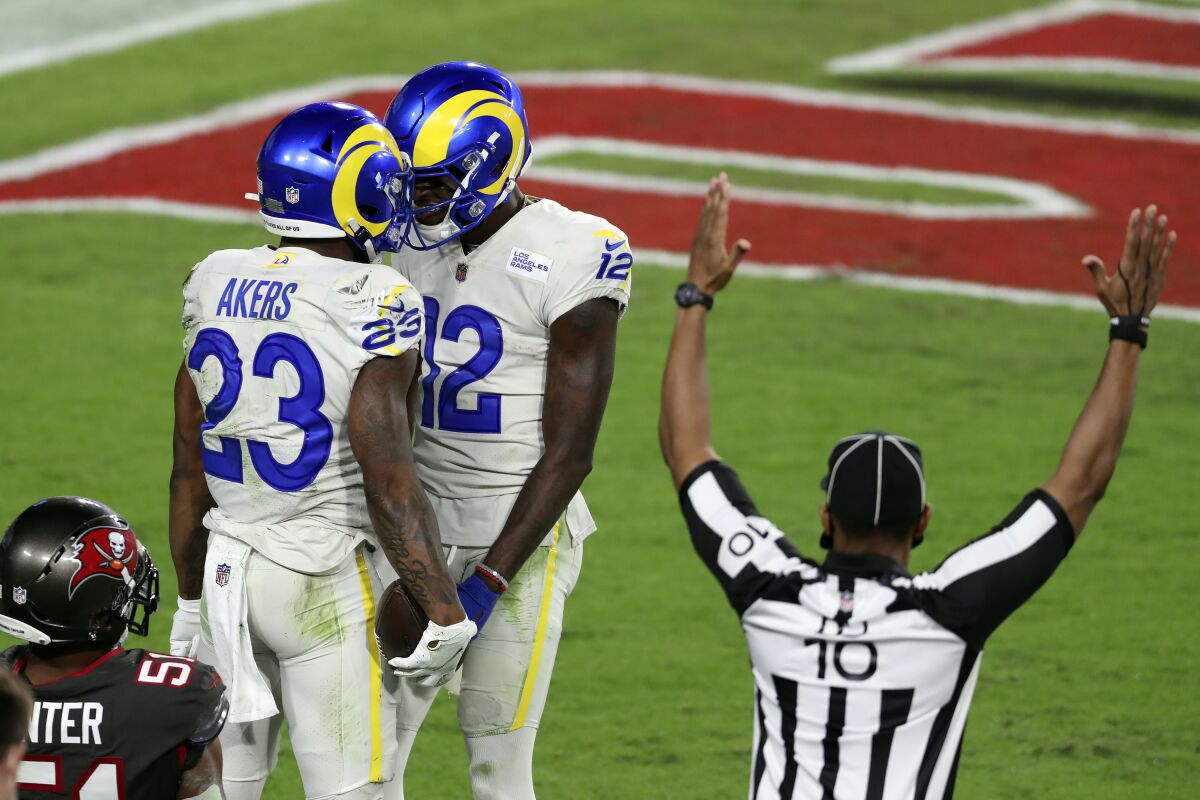 Rams running back Cam Akers (23) celebrates his touchdown against the Tampa Bay Buccaneers with wide receiver Van Jefferson.