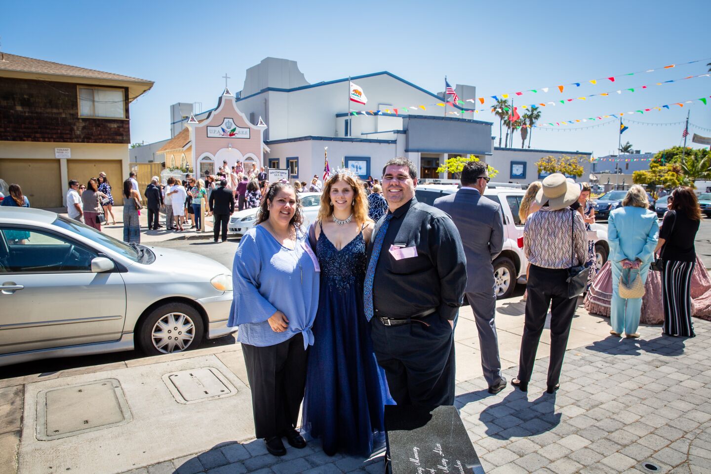 Deborah, Jenavieve and Brian Dutra attend the Festa do Espirito Santo ceremonies at the United Portuguese Society of the Holy Spirit in Point Loma.