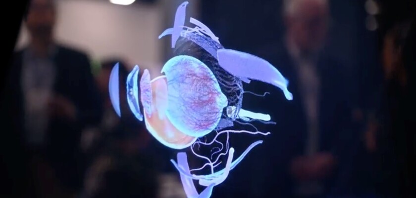 Ikin's desktop device displays a volumetric eyeball.