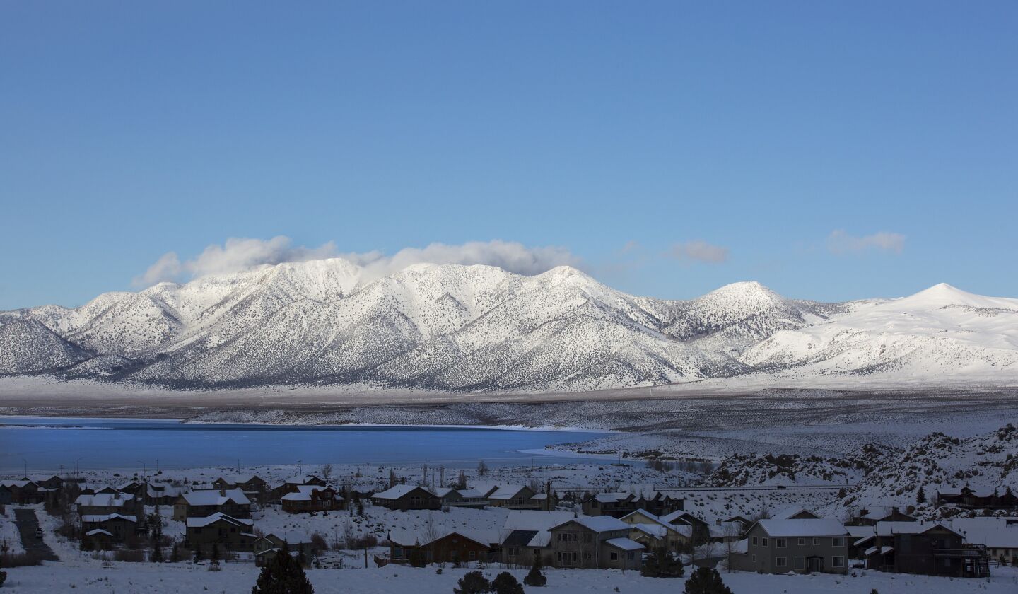 Snow-covered mountains provide a dramatic backdrop for Crowley Lake.