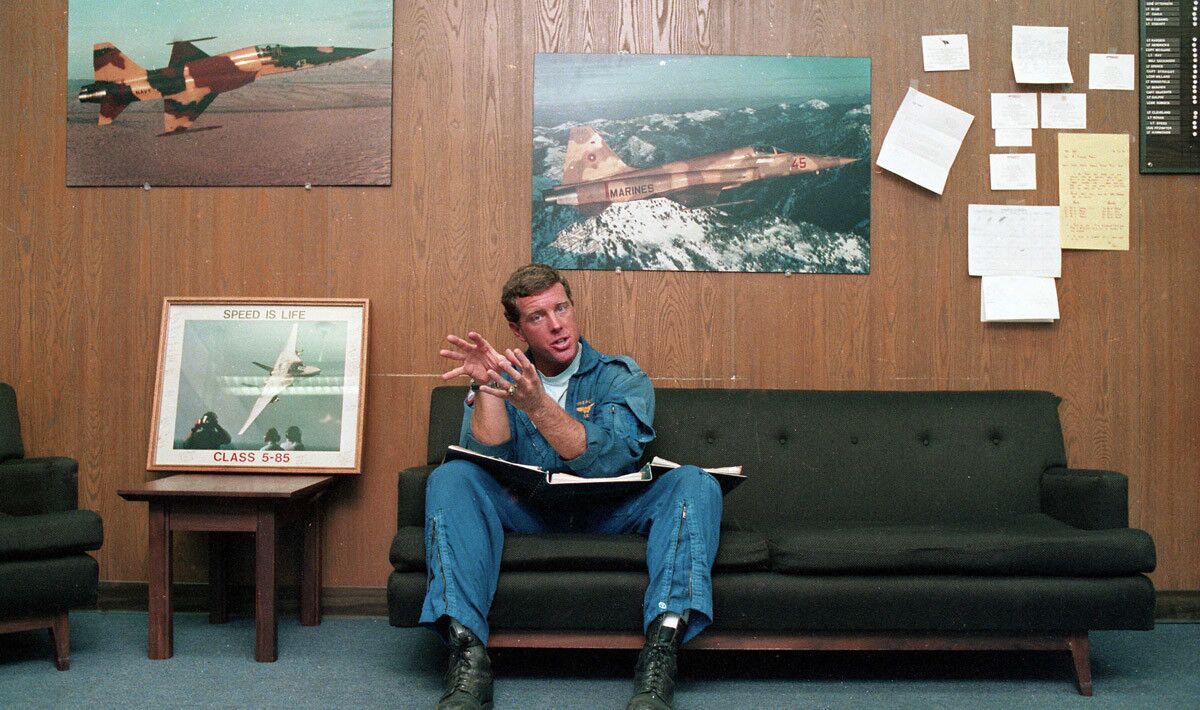 Lt. Mike Galpin in the ready room during on-location filming for the movie, "Top Gun" at the Navy's Fighter Weapons School for elite pilots at Miramar Naval Air Station in San Diego, California on Aug. 14, 1985. "It's kind of fun to watch them do their job," said Galpin, better known as "Flex" because of his affinity for working out at the gym. "Of course, our main job here is to fly. We'd like to see them do a documentary about Top Gun, but it's the Hollywood stuff that sells movies." User Upload Caption: U-T file photos of pilots and planes at Miramar Naval Air Station during the filming of Paramount Pictures "Top Gun" movie in the summer of 1985.
